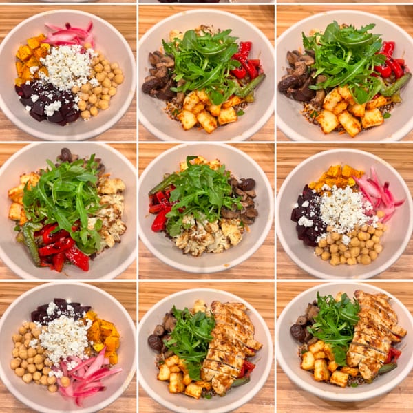 Nine Greek bowls with various toppings like chicken, halloumi, vegetables, and feta cheese.